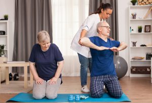 Therapist helping old man